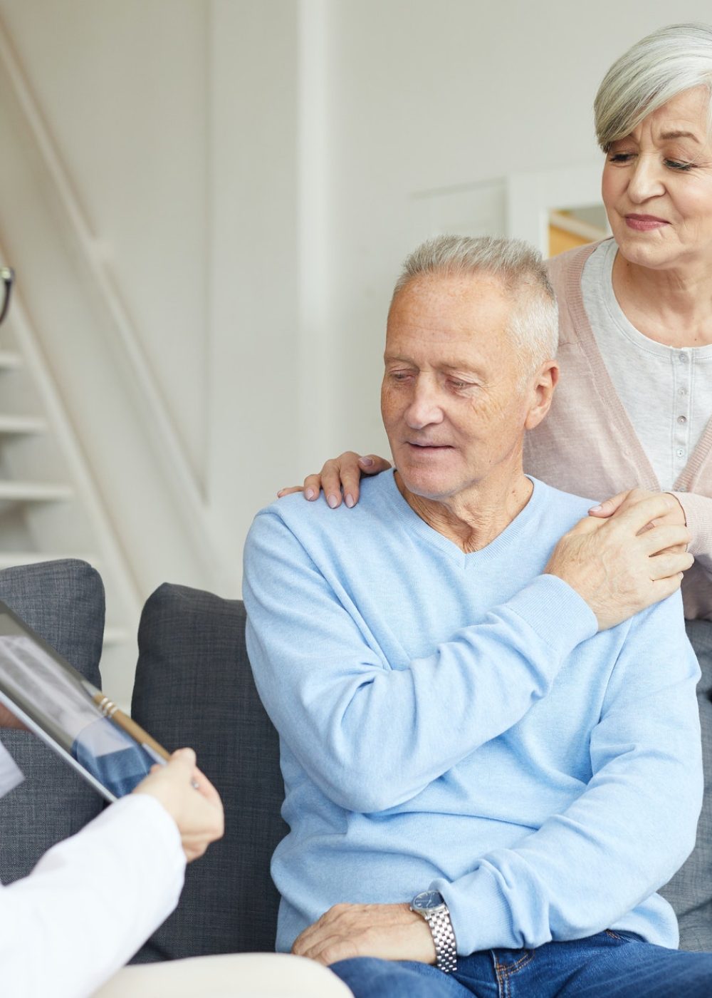 Caring Senior Couple Visiting Doctor